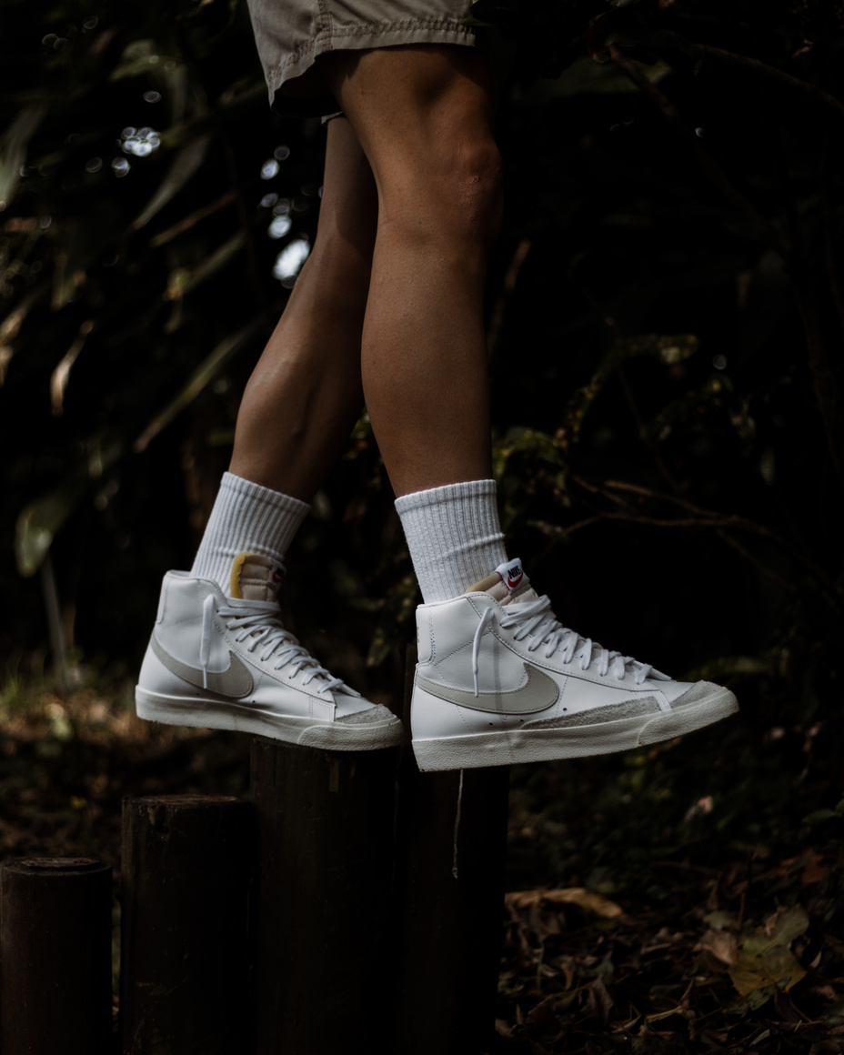 Person Wearing White Nike Sneakers
